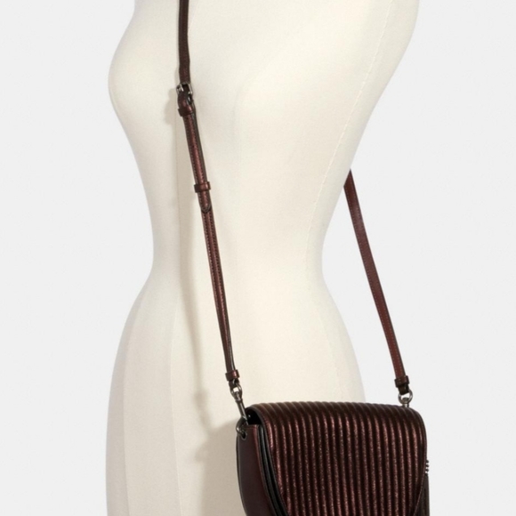 Coach crossbody Linear Quilting include